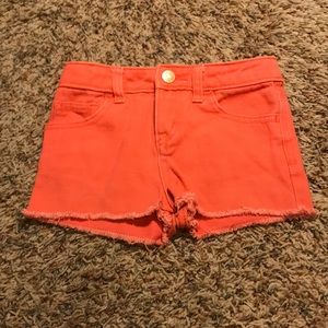 Orange shorts with stringy bottom